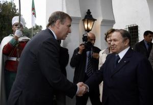 Algeria's President Abdelaziz Bouteflika (R) shakes hands with Britain's