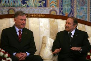 Algeria's President Abdelaziz Bouteflika (R) discusses with  his
