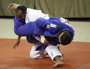 Mohsen al Sentraak from Morocco (L) grapples with Omar