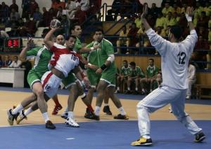 Algeria's players try to stop Jordan's Abdul Rahman Ahmed