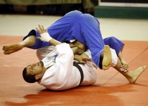 Omar Moriga from Algeria (bottom) grapples with Yaser Ayad