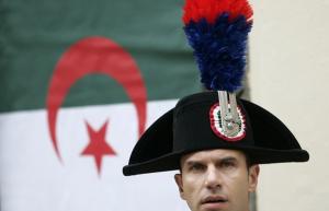 Italian Carabiniere stands guard during a meeting between Italy's