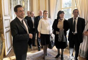 France's President Nicolas Sarkozy (L) poses next to French