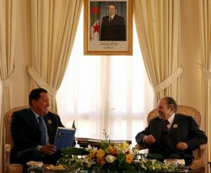 Venezuela's President Hugo Chavez (L) attends a bilateral meeting
