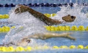 Dina Hegazy (R) of Egypt swims her way to