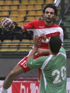 Egypt's Mahmoud Abd Islam (top) scores past Yihi Sheed
