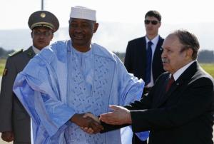 Algeria's President Abdelaziz Bouteflika (R) welcomes his Malian counterpart