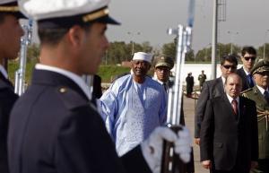 Algeria's President Abdelaziz Bouteflika (R) inspects honour guard with