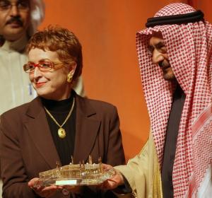 Saudi Arabian culture minister Iyad Madani (R) greets his