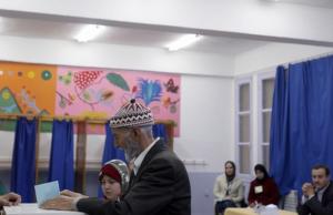 An Algerian casts his ballot at a polling station