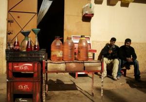 Men sell illegal petrol in Beni Drar, near Oujda,