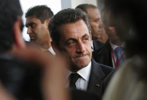 France's President Nicolas Sarkozy looks on upon his arrival