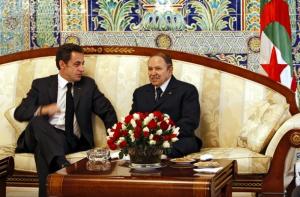 Algerian President Abdelaziz Bouteflika (R) chats with his French