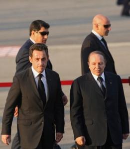 Algerian President Abdelaziz Bouteflika (R) walks with his French
