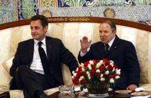 France's President Nicolas Sarkozy (L) meets with Algeria's President