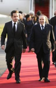Algeria's President Abdelaziz Bouteflika (R) walk with his French