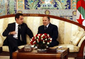 France's President Nicolas Sarkozy (L) meets with Algeria's President