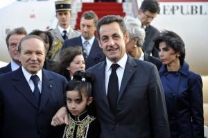 France's President Nicolas Sarkozy (C) poses with Algeria's President