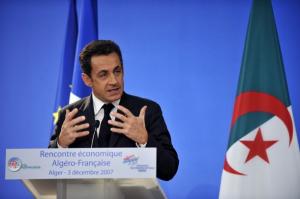 French President Nicolas Sarkozy delivers a speech in front