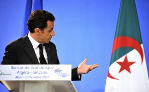 French President Nicolas Sarkozy delivers a speech in front