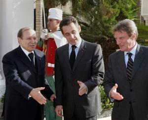 Algerian President Abdelaziz Bouteflika, left, welcomes French President Nicolas