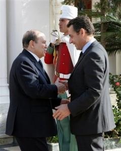 French President Nicolas Sarkozy, right, is welcomed by his