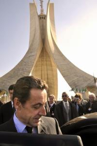 French President Nicolas Sarkozy leaves the martyr sanctuary of