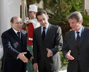 Algerian President Abdelaziz Bouteflika (L) greets French President Nicolas