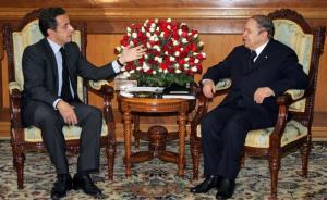 French President Nicolas Sarkozy (L) gestures as he speaks