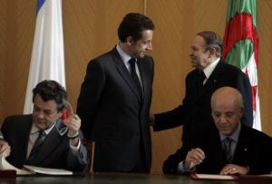 Algeria's Abdelaziz Bouteflika (back R) talks to his French