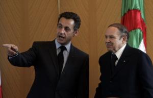 Algeria's President Abdelaziz Bouteflika (R) listens to his French