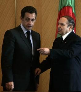 Algeria's President Abdelaziz Bouteflika (R) talks to his French