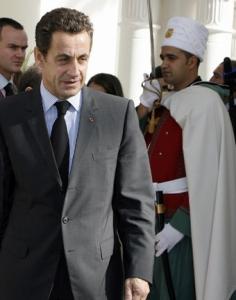 France's President Nicola Sarkozy walks past a republican guard