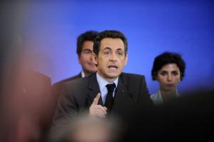 French President Nicolas Sarkozy delivers a speech to members