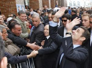 France's President Nicolas Sarkozy (R) and Algeria's President Abdelaziz