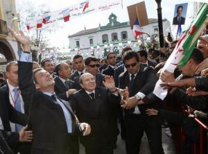 France's President Nicolas Sarkozy (L) and Algeria's President Abdelaziz