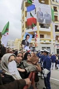 People wait for Algerian President Abdelaziz Bouteflika and French