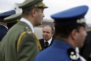 Algeria's President Abdelaziz Bouteflika is welcomed by military representatives