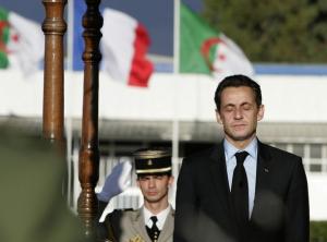 France's President Nicolas Sarkozy listens to the national anthem