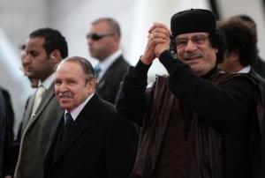 Algeria's President Abdelaziz Bouteflika (L) and Libyan leader Moamer