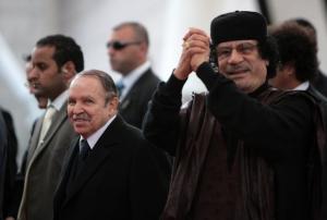 Algeria's President Abdelaziz Bouteflika (L) and Libyan leader Moamer