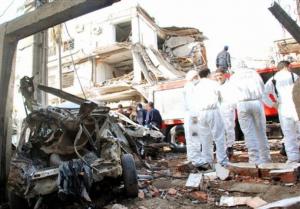 Rescuers work through the rubble of a destroyed building
