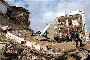 Rescuers work at the site of a bomb blast