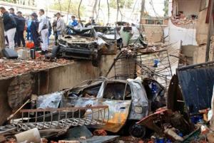 Rescuers and forensic policemen work at the site of