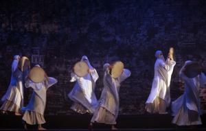 A Syrian traditional dance team performs during the inaugural