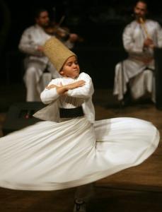 A Syrian traditional dance team performs during the inaugural
