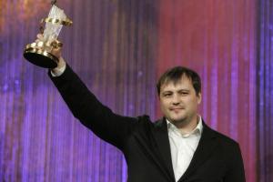 Russian film director Alexei Mizgirev holds the golden star