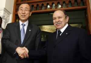 Algeria's President Abdelaziz Bouteflika (R) shakes hands with United
