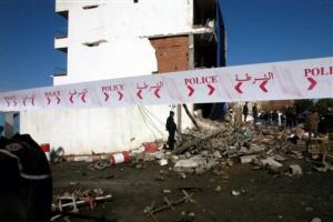 Rescuers and policemen work in a cordoned off area