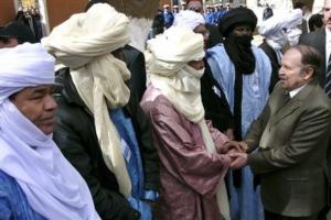 Algerian President Abdelaziz Bouteflika, right, meets Touareg people as